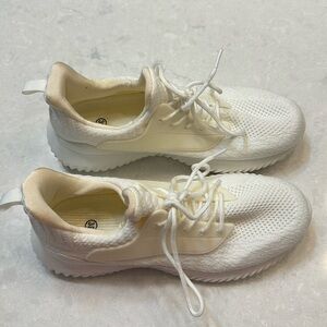 Woman’s white sneakers